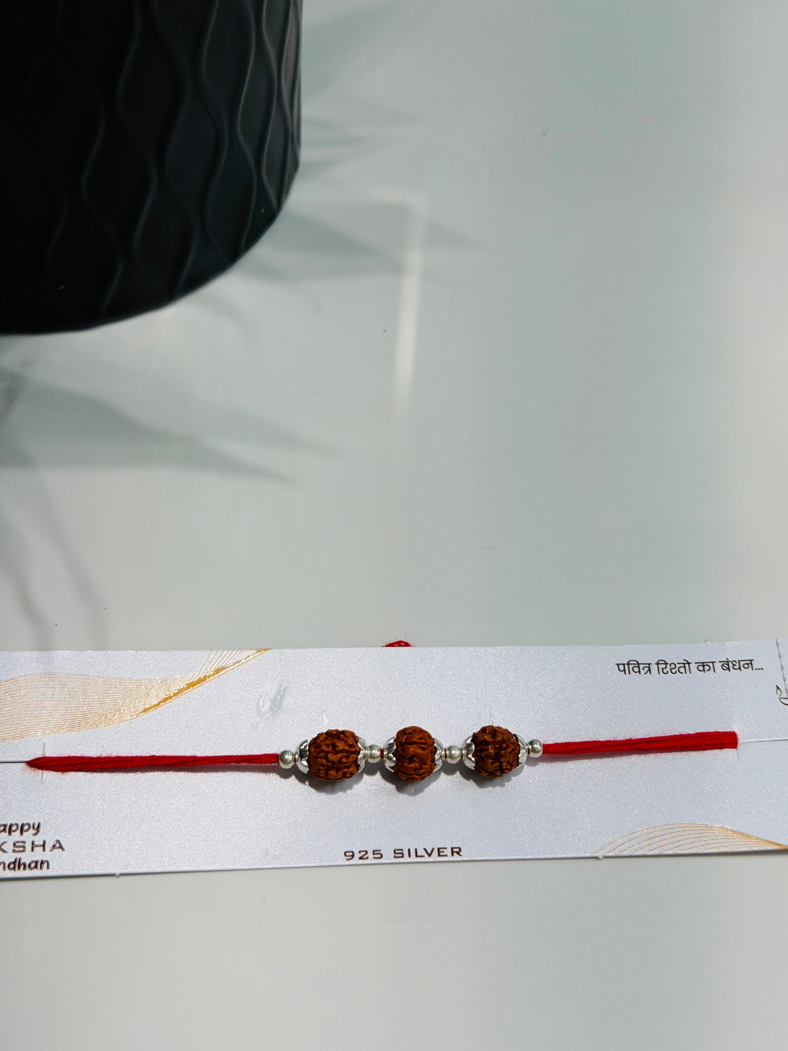 Rakhis with Triple Rudraksha